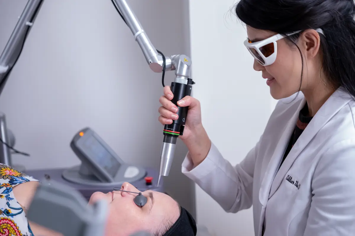 The nurse gives the Cynosure-Lutronic Revlite SI Q-Switch Laser Treatments in Cary, NC